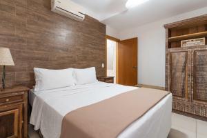 Cama o camas de una habitación en Bossa Jurerê Hotel