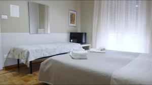 Postel nebo postele na pokoji v ubytování B&B Alpaca Biella + 35 fotografií