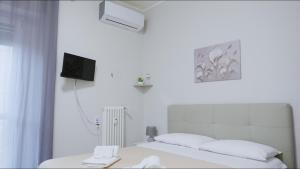 Postel nebo postele na pokoji v ubytování B&B Alpaca Biella