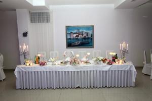 a table in a room with a white table cloth at Villa Sveti Križ in Trogir