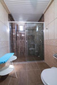 a shower with a glass door in a bathroom at Villa Manolya in Kalkan +24 photos