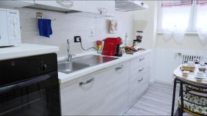 Kuchyň nebo kuchyňský kout v ubytování B&B Alpaca Biella + 35 fotografií