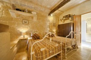 Postelja oz. postelje v sobi nastanitve Gozo Break Farmhouses