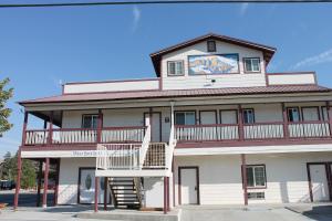 a building with a white staircase in front of it at Whitney Portal Hotel And Hostel in Lone Pine