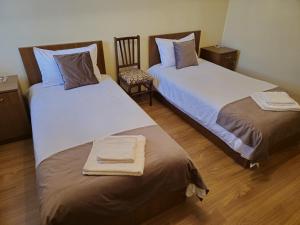 Ein Bett oder Betten in einem Zimmer der Unterkunft Zartonq