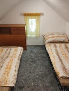 Ένα ή περισσότερα κρεβάτια σε δωμάτιο στο Chata Jana