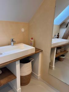 a bathroom with two sinks and a mirror at Le Meix Saint Vital in Barizey +69 photos