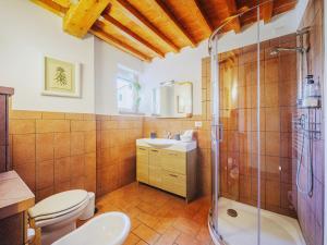 a bathroom with a toilet and a shower and a sink at Casa Aida Luxury Apartment in the Heart of Lucca in Lucca +21 photos