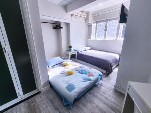 Postel nebo postele na pokoji v ubytování Pillows CoLiving
