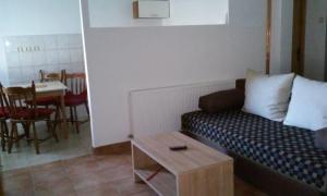a living room with a couch and a table at Apartment Laura in Gračac