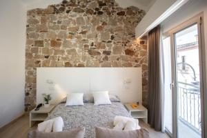 Postel nebo postele na pokoji v ubytování Domu Noa Hotel