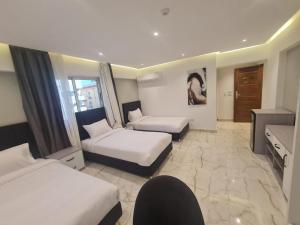 Voodi või voodid majutusasutuse El Mesaadya Hotel فندق المساعدية toas
