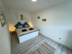 Ένα ή περισσότερα κρεβάτια σε δωμάτιο στο BOHO Apartment Vintage nähe Salzburg