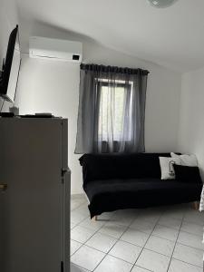 Televízia a/alebo spoločenská miestnosť v ubytovaní Apartments A&S + 27 fotografií