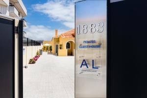 a door with a sign for a house with a sale at Pontes Guest House in Arcozelo