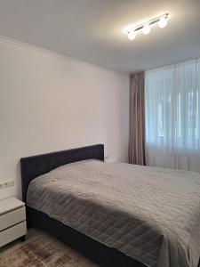 En eller flere senge i et værelse på City Luxury Apartment