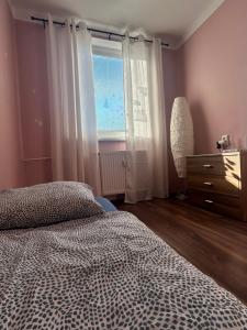 Postel nebo postele na pokoji v ubytování Apartman Rose