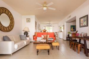 a living room with a couch and a table at Stunning condo in excellent location in Cancún