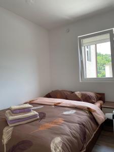 Postel nebo postele na pokoji v ubytování Apartmani Vrla NEW
