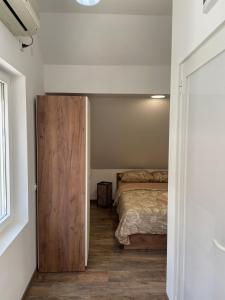 Postel nebo postele na pokoji v ubytování Apartmani Vrla NEW