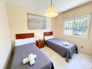 Posteľ alebo postele v izbe v ubytovaní Apartamento la Reserva de Marbella
