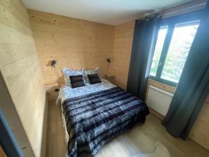 Ένα ή περισσότερα κρεβάτια σε δωμάτιο στο Appartement style chalet T4
