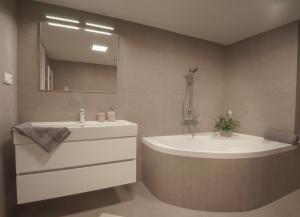 Koupelna v ubytování Apartments Poděbradova Premium + 23 fotografií