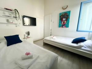 Ένα ή περισσότερα κρεβάτια σε δωμάτιο στο SeaFun Apartment Gajac