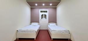 Uma cama ou camas num quarto em Sim-Sim Hostel