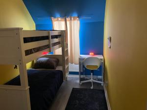 a small room with a bunk bed and a desk at Nature City Blend Cozy 3 BR in Belfast