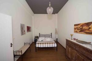 a bedroom with a bed in the corner of a room at Korasida View Apartment in Akhladherí