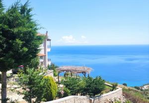 a house with a view of the ocean at Korasida View Apartment in Akhladherí