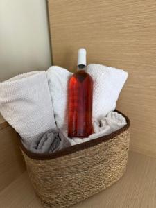 a bottle of soap sitting on top of a towel at Apartment GM in Neoi Epivates