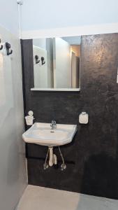Vannituba majutusasutuses Hotel Theoxenia