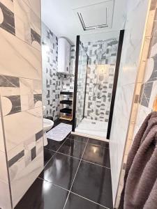 a bathroom with a shower and a toilet at Apartment Žega in Kaštela