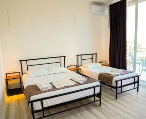 Letto o letti in una camera di Hotel General Tso Kobuleti