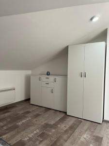 Kuchyň nebo kuchyňský kout v ubytování Apartman 24