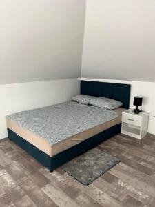 Postel nebo postele na pokoji v ubytování Apartman 24
