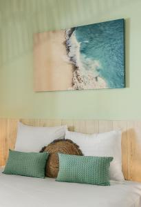 Ένα ή περισσότερα κρεβάτια σε δωμάτιο στο CORAIL - Maison 2 chambres à 50 m de la plage de l'Etang-Salé-les-Bains +4 φωτογραφίες