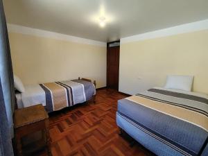 Postel nebo postele na pokoji v ubytování Conquistador Hotel