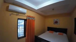 Postel nebo postele na pokoji v ubytování Cataleya Hostel