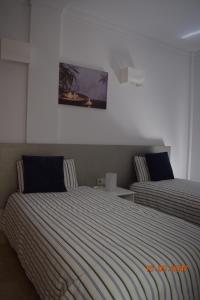 En eller flere senge i et værelse på Sun Bay Villa nº47 + 28 billeder