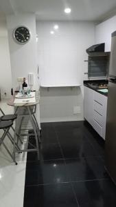 Kuchyň nebo kuchyňský kout v ubytování Apartamento de descanso Peñalisa Ricaurte