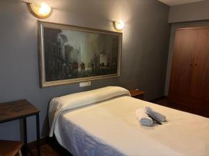 Un pat sau paturi într-o cameră la Bakiola
