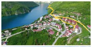 an aerial view of a town next to a river at Kulic 2 in Plužine +6 photos