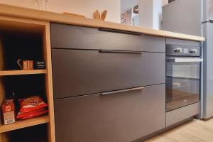 a large stainless steel appliance in a kitchen at l'Atelier - Au pied des quais in Dunkerque