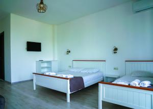 Letto o letti in una camera di Hotel General Tso Kobuleti