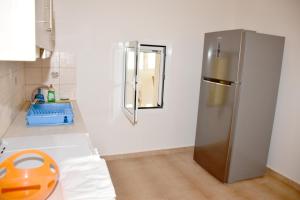 a kitchen with an orange object on the counter at Oceanides House in Lefkandi Chalkidas +21 photos
