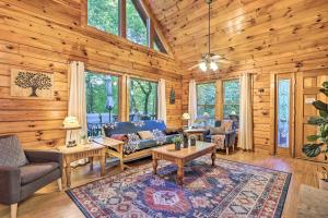 a living room with a couch and a table at Cozy Mountain Cabin in PERFECT location in Sevierville