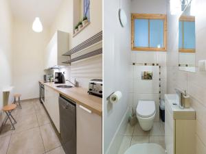 Baño pequeño con aseo y lavamanos en 5 Bedroom Family Apartment, en Cracovia